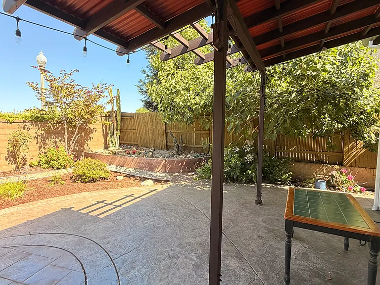 Backyard with ample shade for summer enjoyment