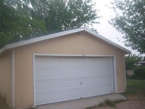 Detached 2 car garage and beautiful side yard.