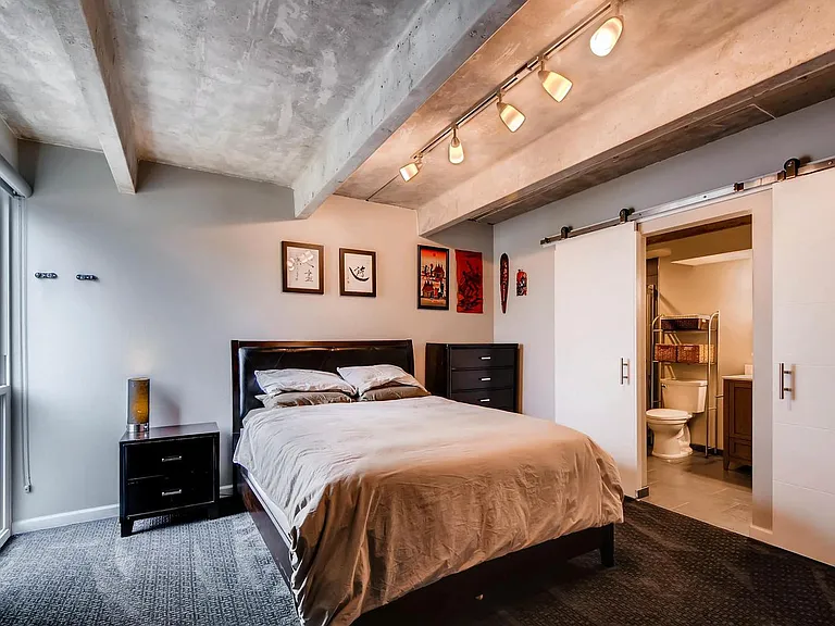 Master bedroom with en-suite bathroom and large walk-in closet.