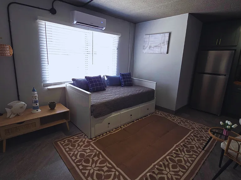 Comfortable seating area next to the fully equipped kitchen.