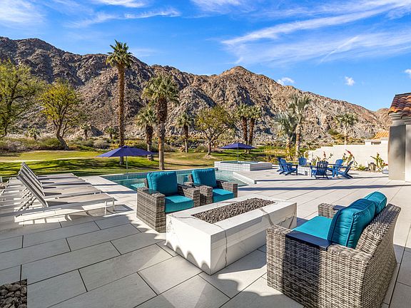 Enjoy the mountain and golf course views from the firepit.
