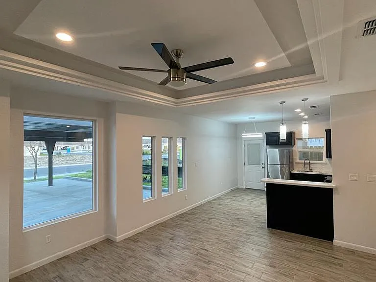 Custom blinds to be installed in all units. This unit is the 2 bedroom 2 bath with remote control modern fans in all rooms.