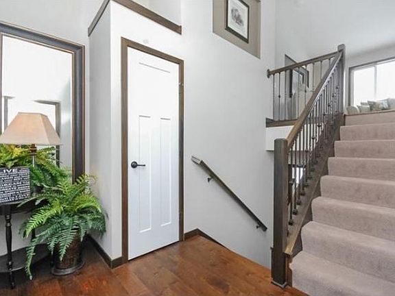 2 story entry with large window above the door and 1 side light in 754.  This home will have a large closet in the entry way.