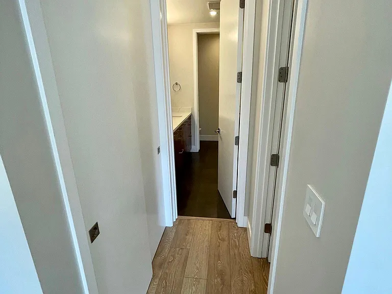Dressing areas, closet on left and walk in closet on right, bath ahead