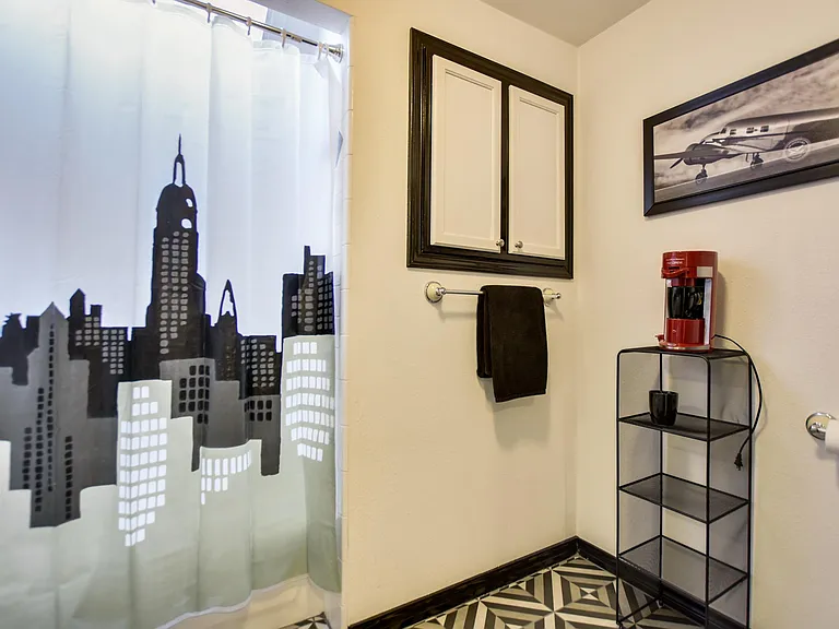 Second Floor Master Bath #2 has a tub/shower combo & ample storage.