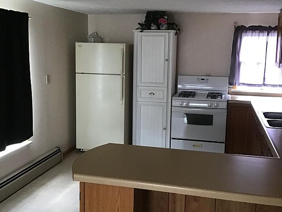 Kitchen with fridge and stove