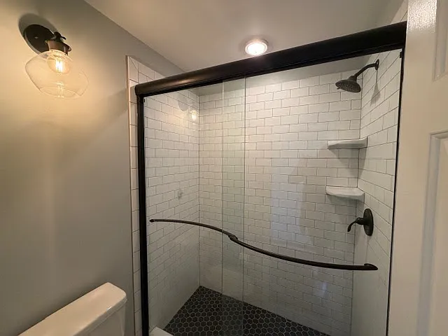 Baths have been renovate , custom shower with black accent fixtures