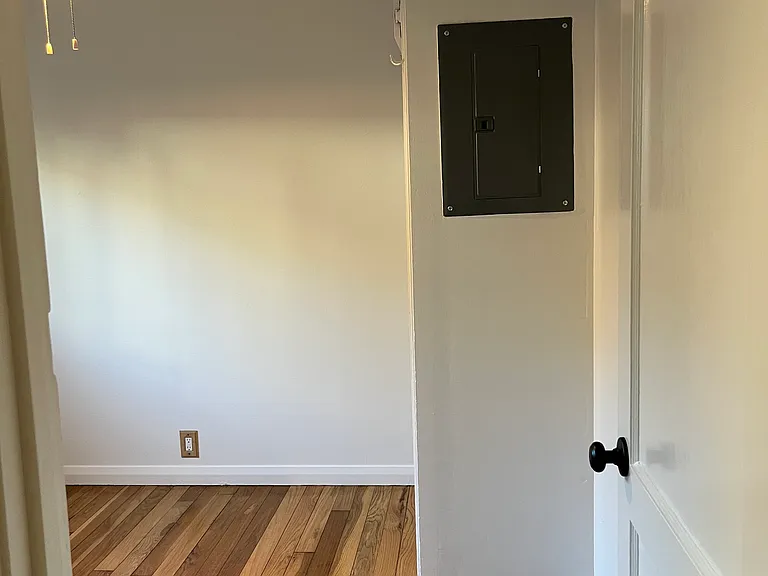 The breaker box is in this bedroom. A cute picture frame could cover it or a dresser would fit nicely in this area.
