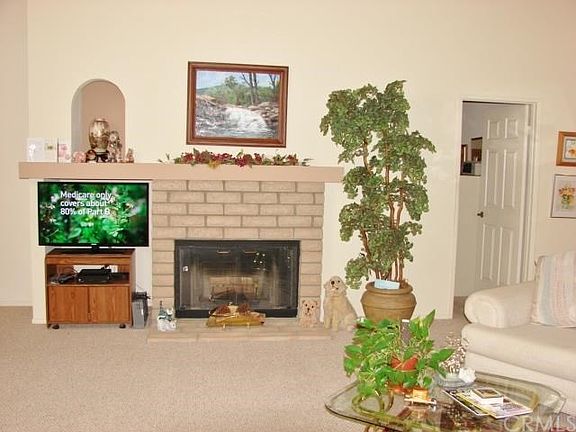 ANOTHER VIEW OF THE LIVING ROOM. DOOR ON RIGHT IS ENTRY TO DEN/3RD BEDROOM.