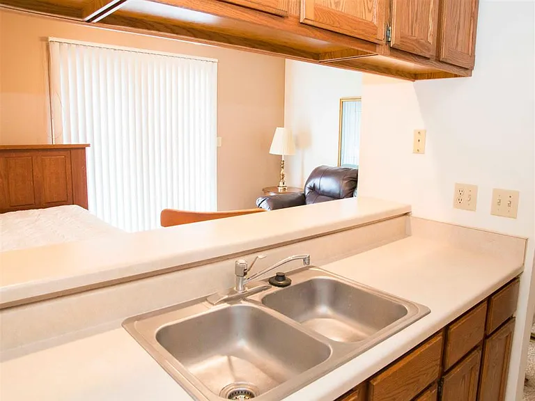 This open counter design lets you chat with guests or enjoy natural light from the living area.