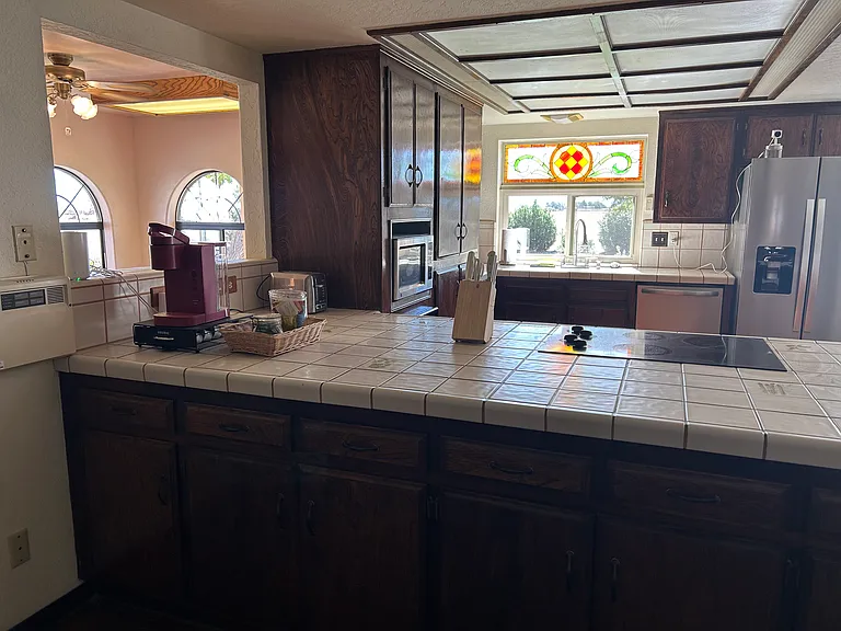 Large kitchen open to enclosed patio. Contains everything!