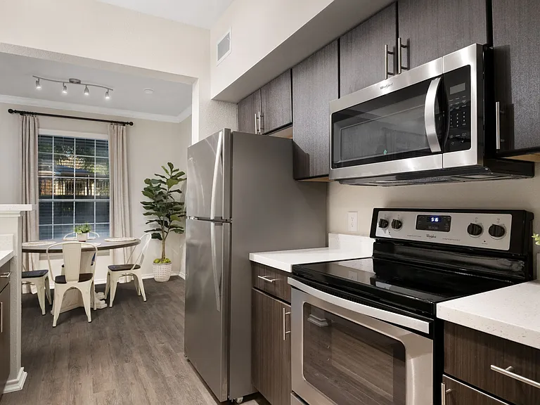 Apartments with wood style flooring and espresso cabinetry
