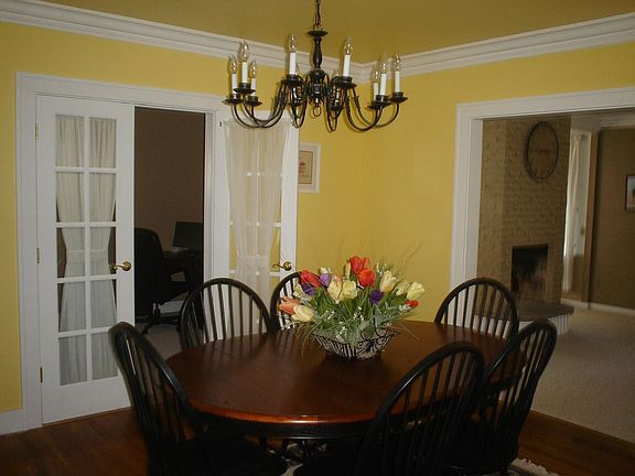 Dining room leads to den 