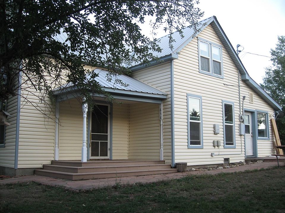 Original 1920 architecture, with new windows, insulation and siding. Garden space is to the right of this photo.