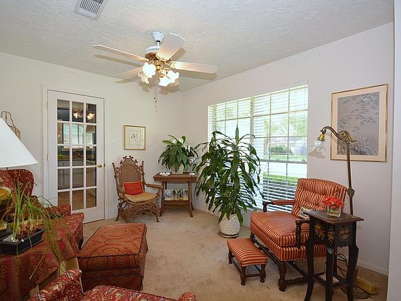 Light and Bright Living Room with glass door access to kitchen.