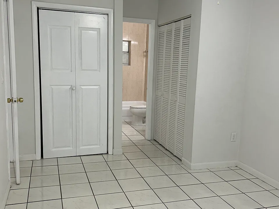 bedroom with 2 closets