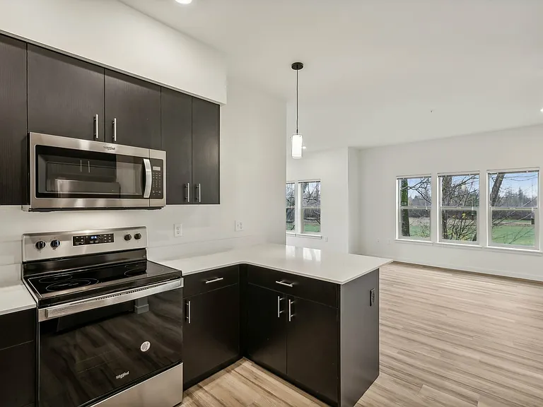 The large kitchen features a peninsula for counter height bar stools. The large kitchen features a peninsula for counter height bar stools.