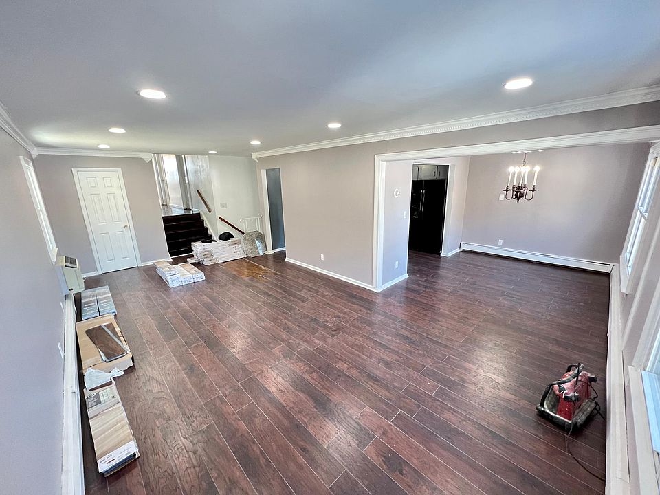 open concept living room into dining room, brand new floors!! New paint, and lighting!!