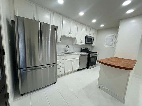 Kitchen with brand new stainless steel appliances