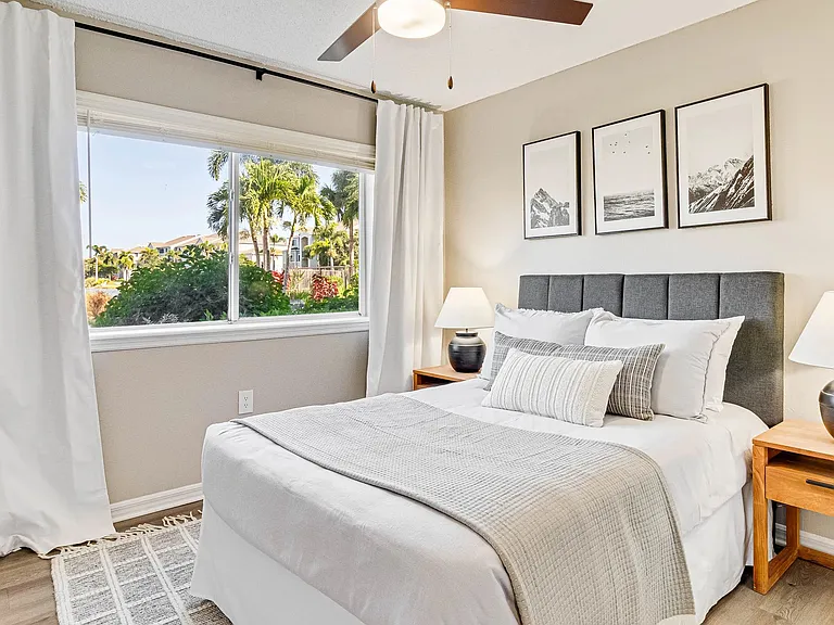Spacious bedrooms with plush carpet or wood-style flooring and ceiling fans for ultimate comfort.