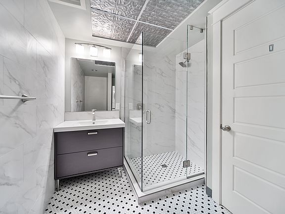 Newly Remodeled Bathroom Shower and Sink