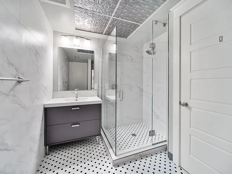 Newly Remodeled Bathroom Shower and Sink