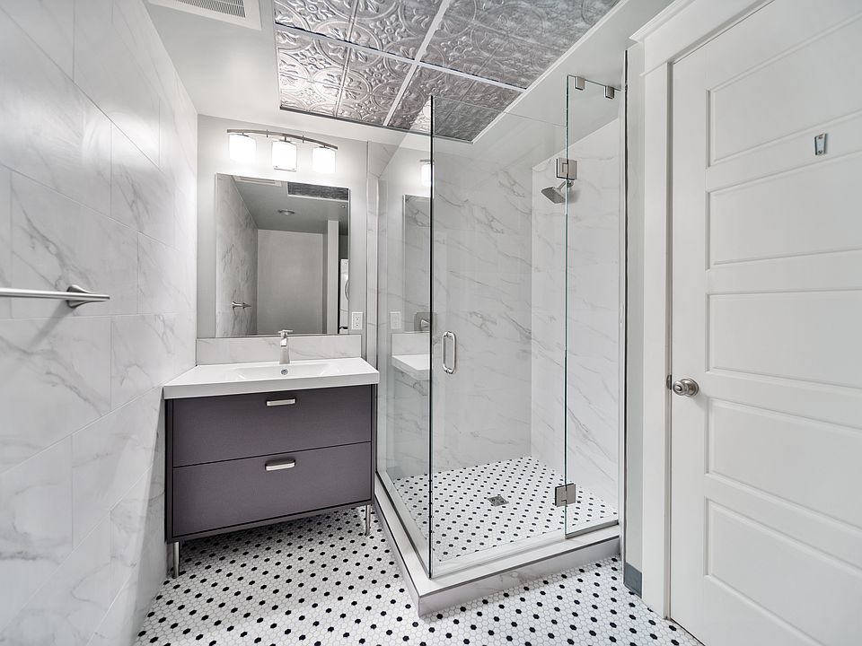 Newly Remodeled Bathroom with Sink and Tile Shower