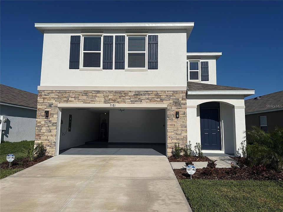 Front of this house and garage space.