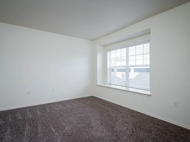 Village at Main Street | 2x2 Bedroom Two with Wall to Wall Carpeting and Light Filled Window