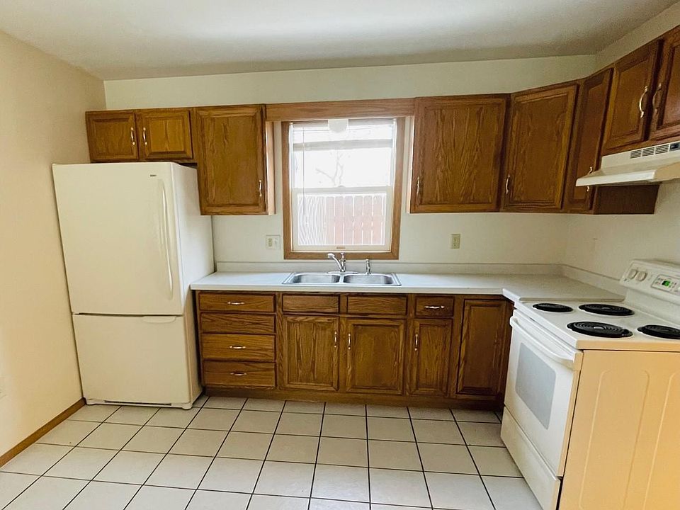 Kitchen has new faucet with sprayer.