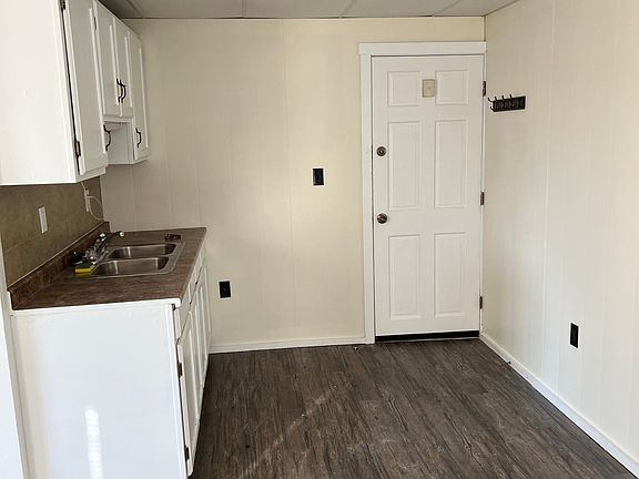 Another kitchen angle. Apartment is on the 2nd floor. Front door leads to inside corridor down to shared coin laundry room inside of the building.