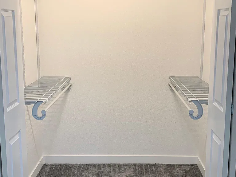 Large walk in closet to the secondary Bedroom 4' by 5' space.