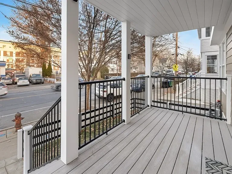 Classic charm: A welcoming front porch perfect for enjoying your morning coffee or watching the neighborhood go by.