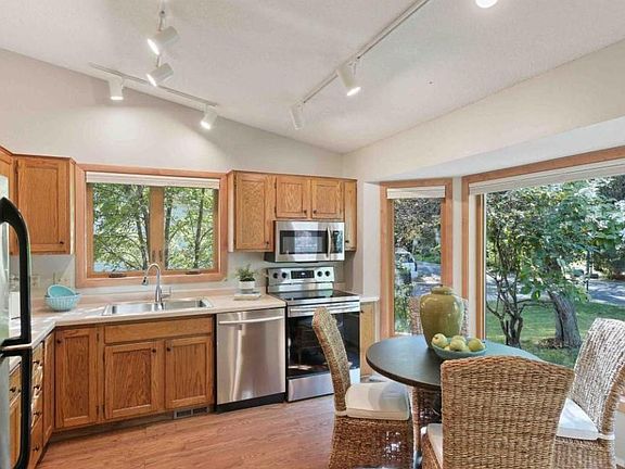 Open kitchen with stainless steel appliances and lots of natural light