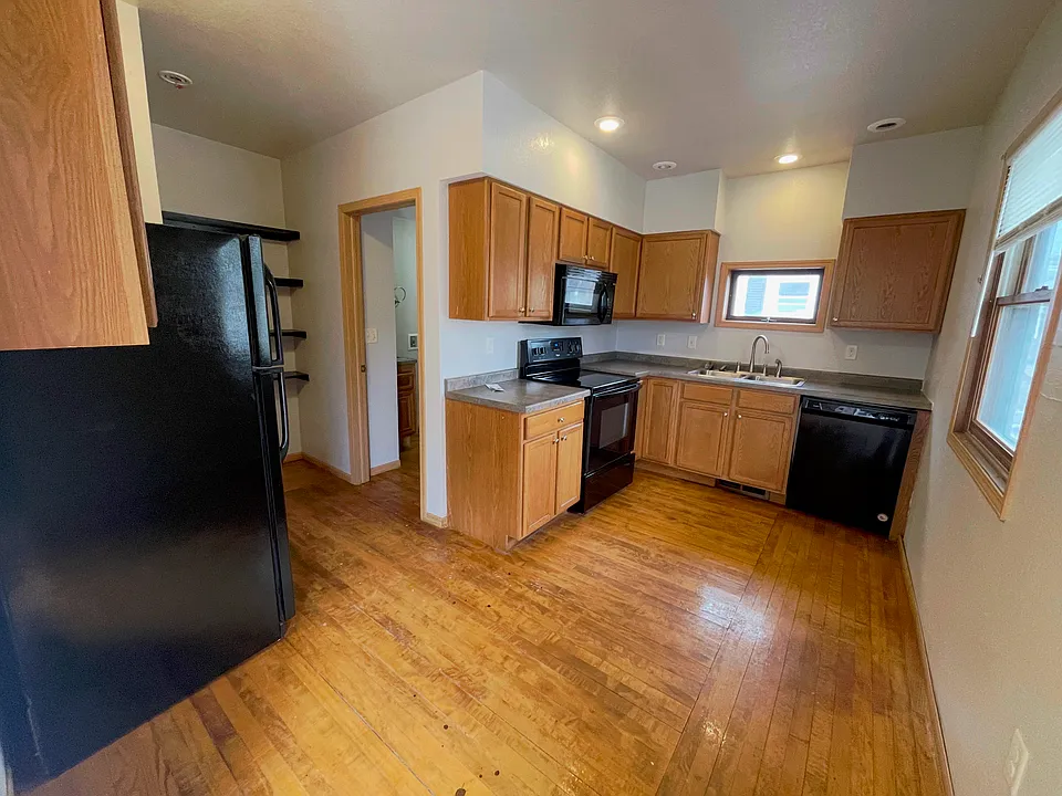 Clean and functional kitchen with ample cabinet space in this 2-bedroom Antigo rental.