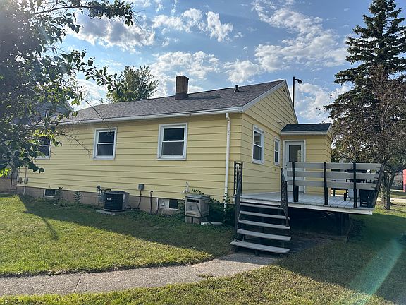 Back of house with deck