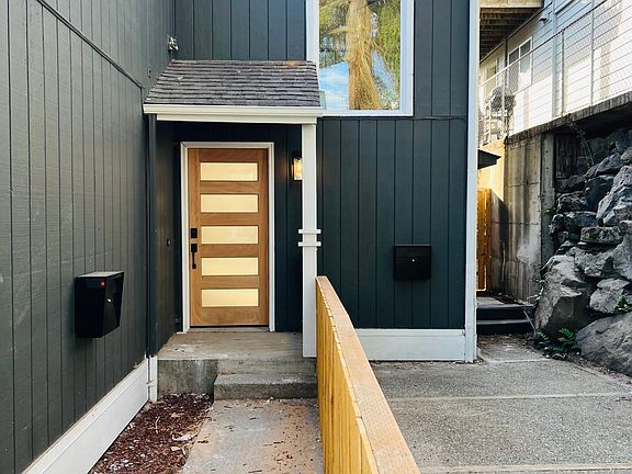 Private fenced in front yard. Private side entrance and awning.