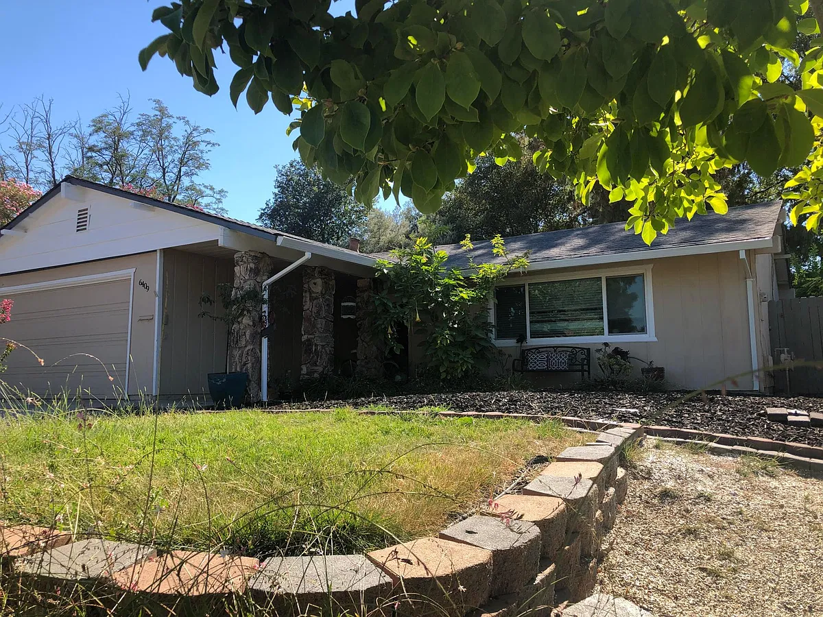 Front side of house, with access gate. - 6409 Bay Hill Way