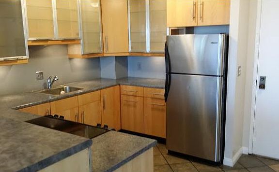 Ample cabinets and frosted glass doors.