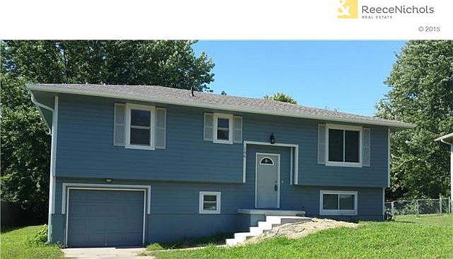 Front of home, NEW roof, siding, doors and shutters!
