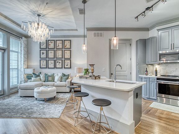 Chef-inspired kitchens feature granite and quartz countertops and stainless steel appliances