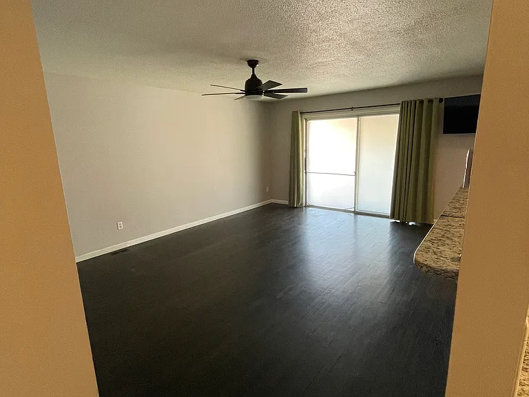 living space 1 with door to backyard.