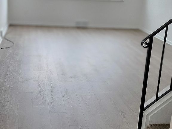 Huge Living Room with large windows on two sides. Lots of natural light !