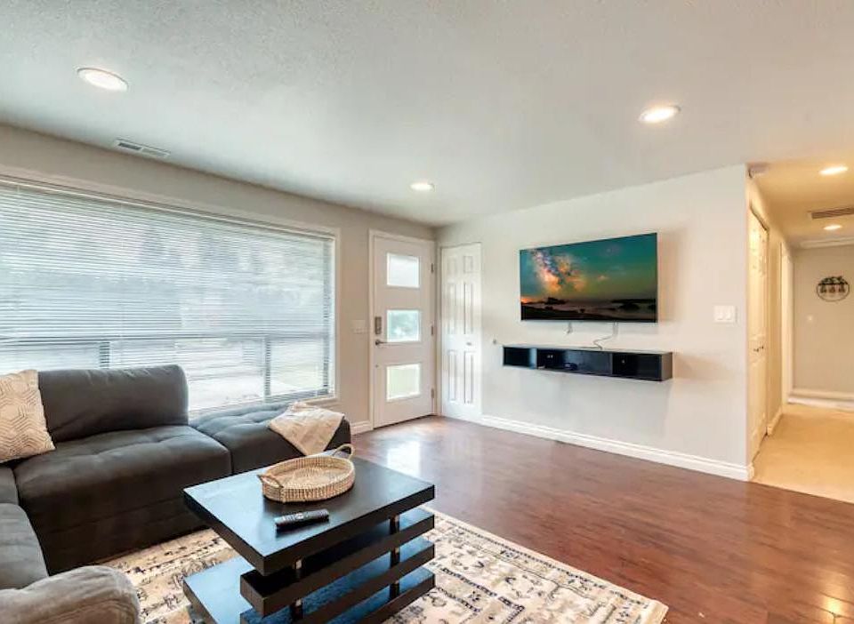 Open & inviting living room with 55" UHD TV w/ Disney + to enjoy with the family