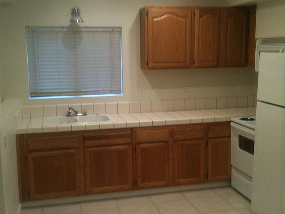 Kitchen with range , microwave, and fridge