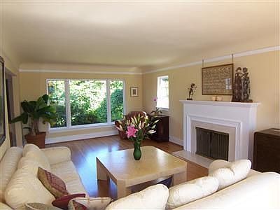 The living room is very spacious and filled with light.
