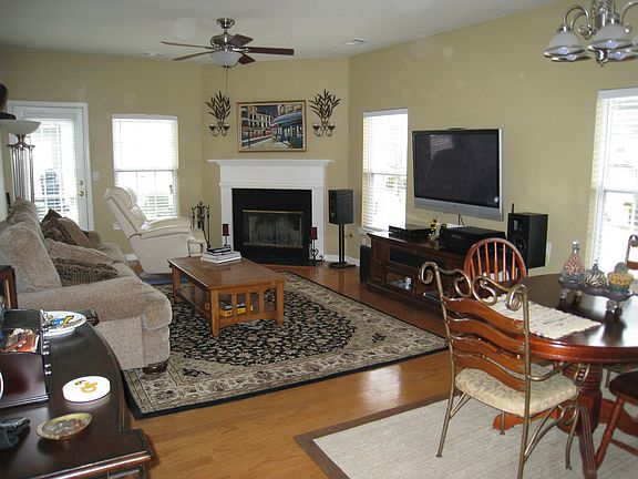 Spacious, hardwood floors, surround sound wired, natural light, fireplace