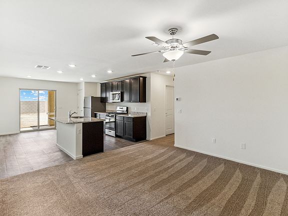 Open, efficient layout with the kitchen, dining area, and living room.
