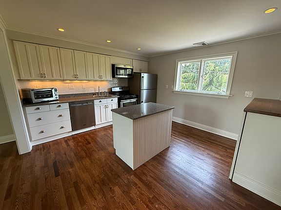 Stainless steel appliances and island