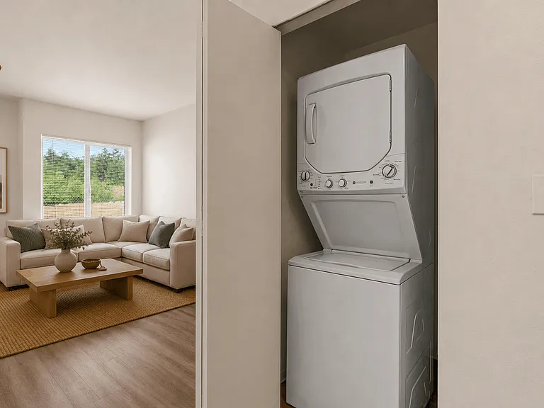 Apartment with in-unit washer and dryer and spacious open-concept living area. Apartment with in-unit washer and dryer and spacious open-concept living area.
